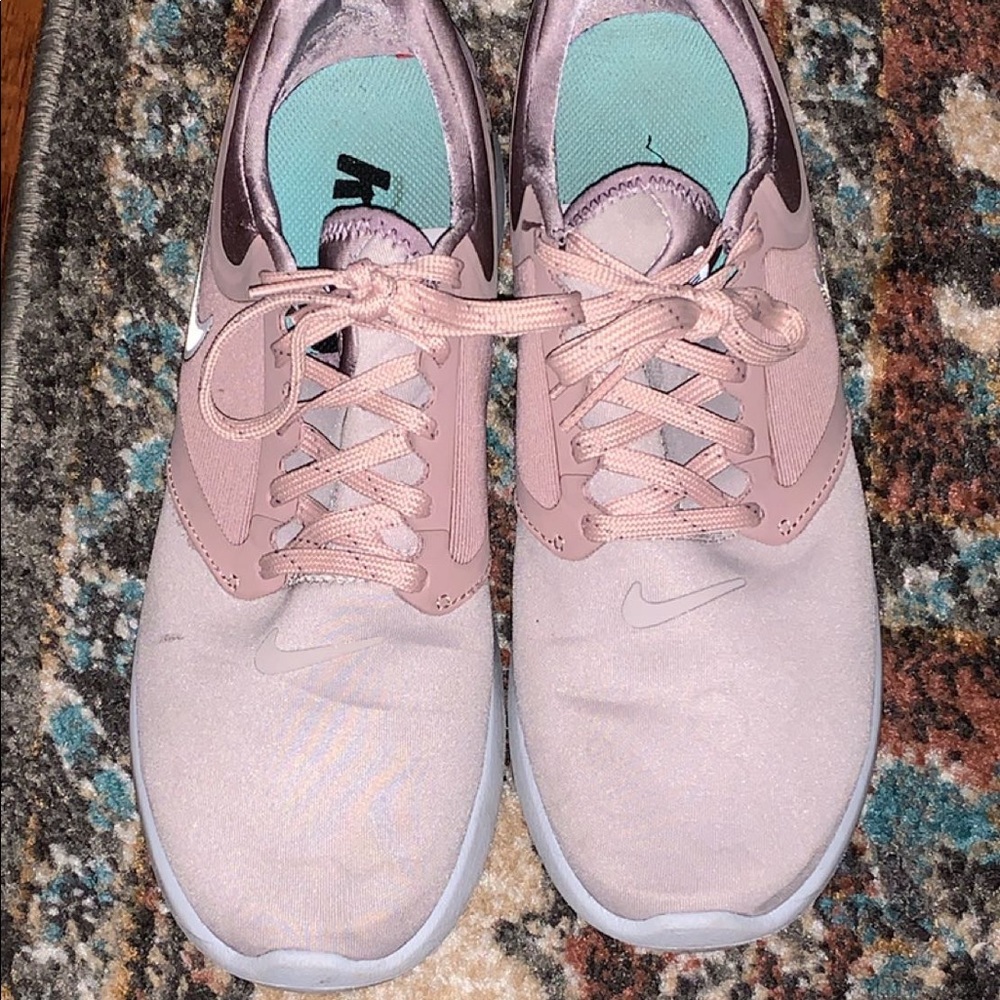 Rose gold/pink Nike tennis shoes